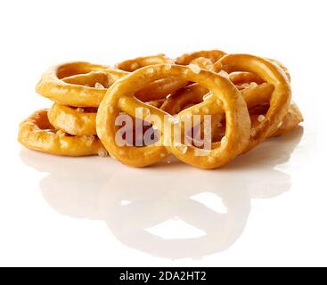 Heap of salted mini pretzels isolated on white background Stock Photo
