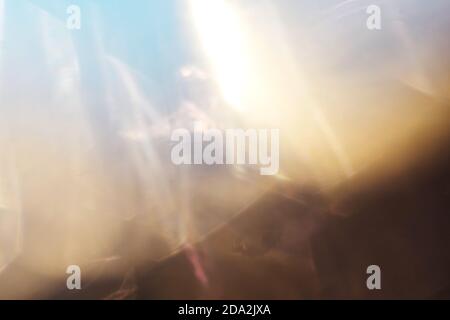 Blue golden blurred background with sun light. Overlay, copy space. Clean sky and sun refraction. Stock Photo
