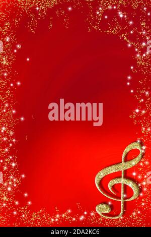 Christmas musical card. Treble clef  in gold  glitter texture on red paper glitter golden frame background with copy space, vertical image. Stock Photo