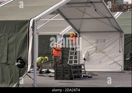 Milan, November 2020, Italian Army, units of NRDC (NATO Rapid Deployable Corps) mount a drive-trough structure for the collections of swabs for the diagnosis of Covid-19 virus in a subway parking area. Stock Photo