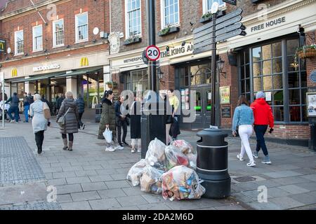 Windsor, Berkshire, UK. 7th November, 2020. Dustbins were full again with take away wrappers as Windsor was much busier today on the third day of the new Covid-19 Coronavirus lockdown. A lot more shops and cafes were open than during the first lockdown. Credit: Maureen McLean/Alamy Stock Photo