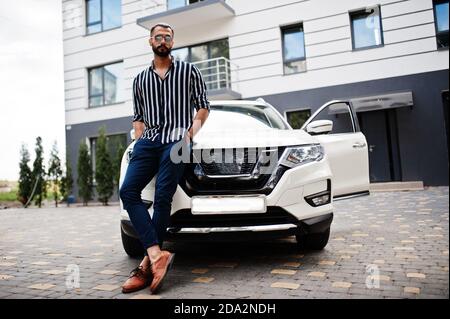 Pretty woman in the green modern car posing for the camera Stock Photo -  Alamy