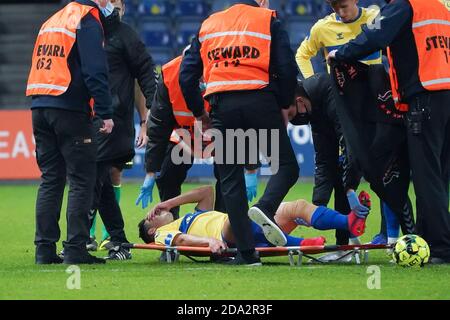 Brondby, Denmark. 08th, November 2020. Blas Riveros (15) of Broendby IF got injured during the 3F Superliga match between Broendby IF and Odense Boldklub at Brondby Stadium. (Photo credit: Gonzales Photo - Kent Rasmussen). Stock Photo