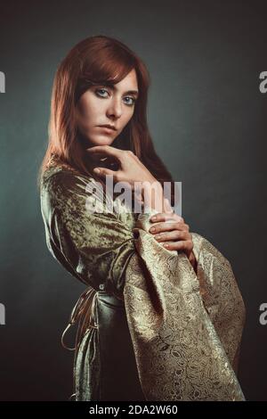 Beautiful red haired woman posing. Studio portrait Stock Photo