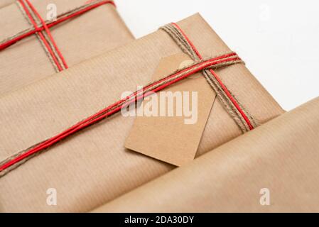 Stack of craft gifts wrapped in recycled paper Stock Photo