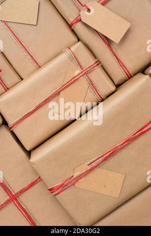 Stack of craft gifts wrapped in recycled paper Stock Photo