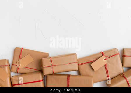 Stack of craft gifts wrapped in recycled paper Stock Photo