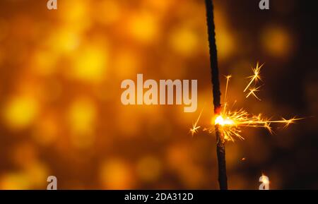 A series of photographs for the holiday New Years and Christmas sparklers on a bright beautiful background and bokeh Stock Photo