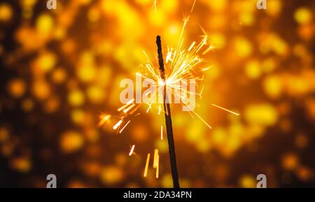 A series of photographs for the holiday New Years and Christmas sparklers on a bright beautiful background and bokeh Stock Photo