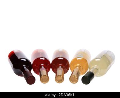 Closeup of different kinds of wine bottles placed next to each other on a white background Stock Photo