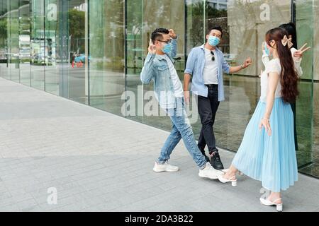Friends greeting each other Stock Photo