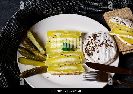 German low fat sour milk cheese with bread and pickles Stock Photo