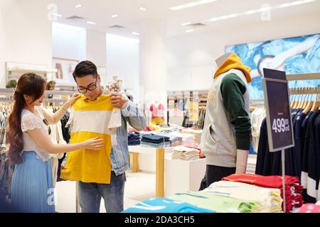 Couple buying clothes Stock Photo