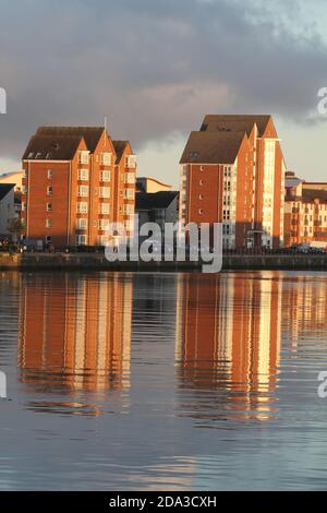 Ayr, Ayrshire, Scotland, UK. Modern private flats apartments on the River Ayr , Ayr Harbour, the apartments are reflected in the water. Stock Photo