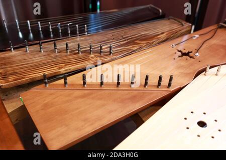 View of ancient Russian instruments of harp on table Stock Photo