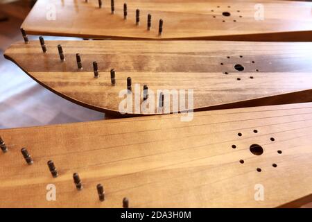 Ancient Russian instruments of harp on table Stock Photo