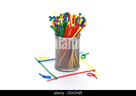 Closeup shot of cable ties in a metallic container on an isolated white background Stock Photo