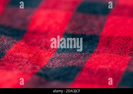 Red and black plaid blanket close up with selective focus Stock Photo