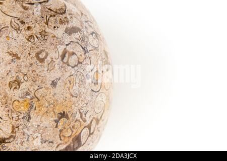 Polished granite stone sphere with interesting fossil-like patterns Stock Photo