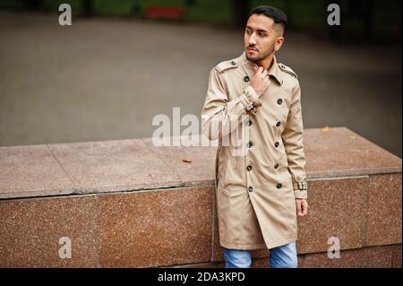 Stylish kuwaiti man at trench coat. Stock Photo