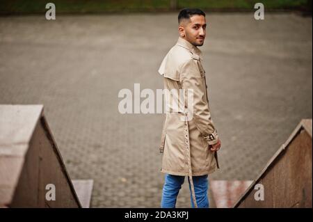 Stylish kuwaiti man at trench coat. Stock Photo
