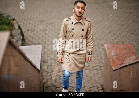 Stylish kuwaiti man at trench coat. Stock Photo