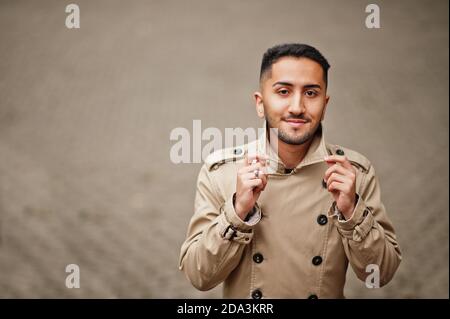 Stylish kuwaiti man at trench coat. Stock Photo