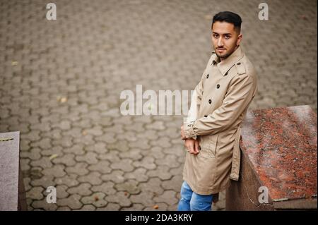 Stylish kuwaiti man at trench coat. Stock Photo