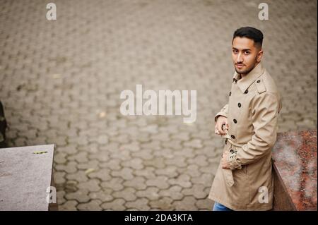 Stylish kuwaiti man at trench coat. Stock Photo