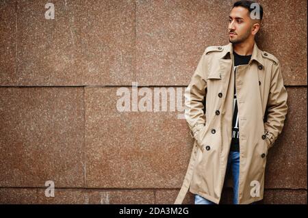 Stylish kuwaiti man at trench coat. Stock Photo