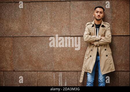 Stylish kuwaiti man at trench coat. Stock Photo
