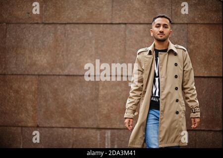 Stylish kuwaiti man at trench coat. Stock Photo