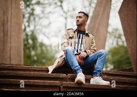Stylish kuwaiti man at trench coat. Stock Photo