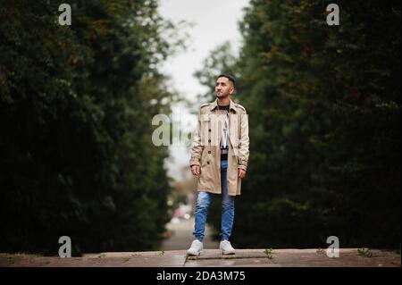 Stylish kuwaiti man at trench coat. Stock Photo