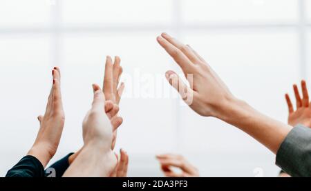 business team giving each other a high five Stock Photo
