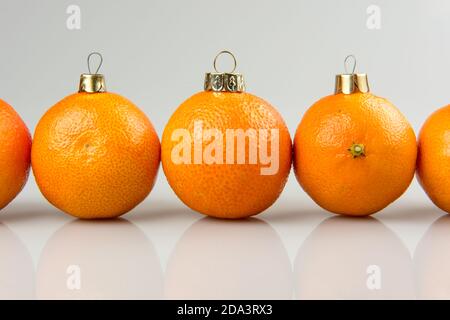 Tangerines Row Line as a xmas ball on Christmas and New Year Stock Photo