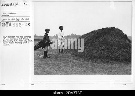 Golf Tourney for the benefit of the American Red Cross, Montclair, N.J., July 17, 1918. Bobby Jones driving over a bunker. Stock Photo