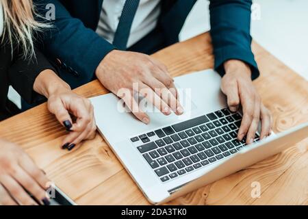 close up. employees use a laptop to view the information they need Stock Photo