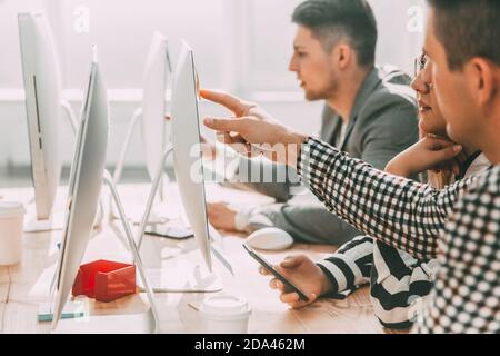 close up. the working group is discussing information on a comp Stock Photo