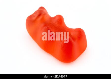 A macro shot of a red gummy bear, isolated on a white background. Stock Photo