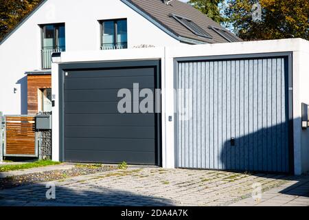 two different garage doors side by side Stock Photo