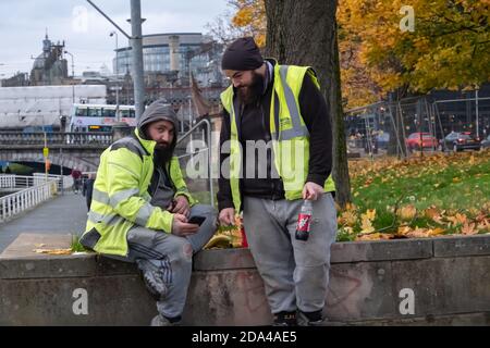 Glasgow, Scotland, UK. 9th November, 2020. UK Weather. Two construction workers taking a break. Credit: Skully/Alamy Live News Stock Photo