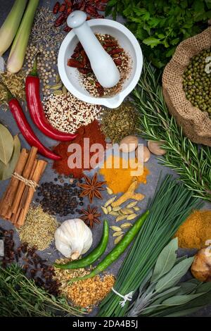 Herbs and Spices on a grey slate background. Stock Photo