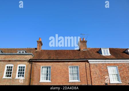 7 November 2020 - England, UK: Row of heritage houses with copyspace in sky  Stock Photo