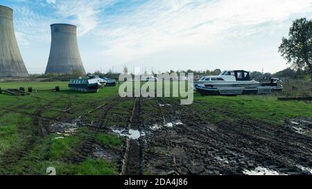 Old boats in a muddy field Stock Photo