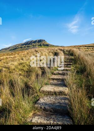 Pen-y-ghent mountain with path and steps. At 2277 feet it is one of the Three Peaks of Yorkshire mountains. Yorkshire Dales National Park Stock Photo