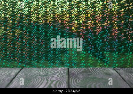 Brushed pine boards painted black and white. The iridescent surface is green. Stock Photo