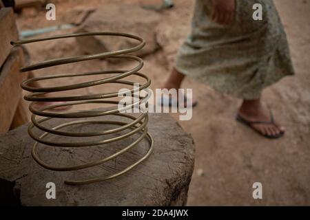 Mae Hong Son, Thailand, March 2012. Metal spiral used by ethnic Karen women and by what are known as long-necked women.