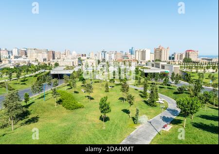 Baku, Azerbaijan – July 26, 2020. View of the Central Park in downtown Baku, with residential buildings in the background. Stock Photo