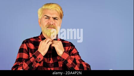 Coloring beard. Expression of inner you. Moisturise and apply beard oils. Handsome man unshaven face. Fashion trend. Bearded man checkered shirt. Hipster dyed beard. Hairdresser and barbershop. Stock Photo